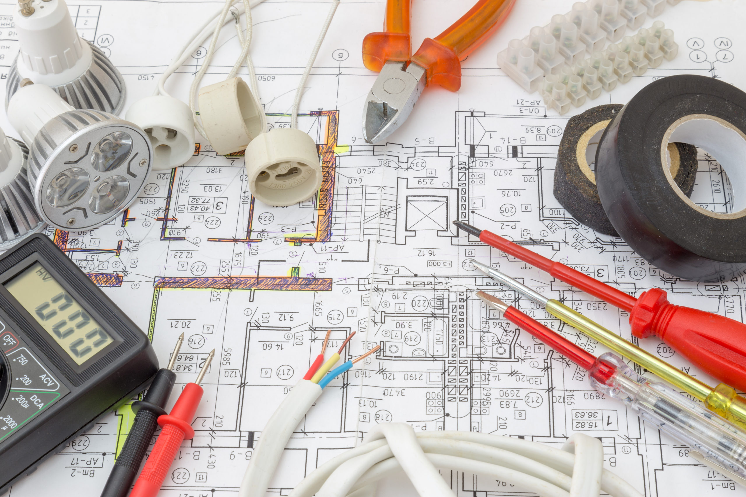 still life of electrical components arranged on plans
